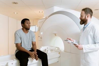 Radiology center patient talking to a doctor during a scan